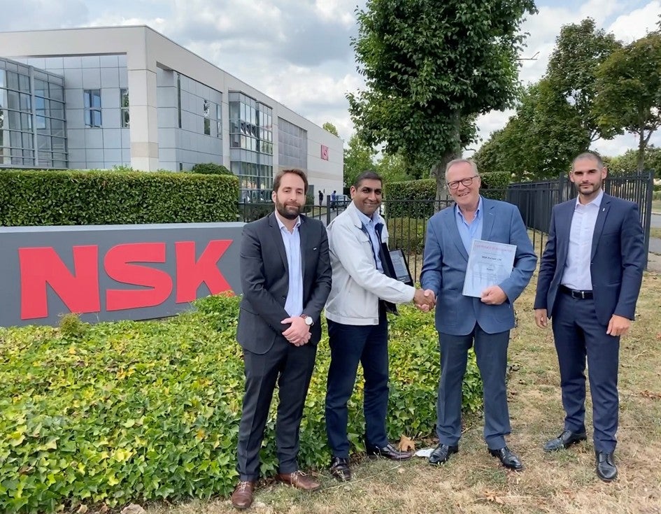 Handing over the awards outside the Guyancourt facility of NSK in France: Adrien Le Berre (NSK), Rashmi Shah, Head of TME Purchasing; Franck Keiffer (NSK) and Maxime Marsala (NSK)