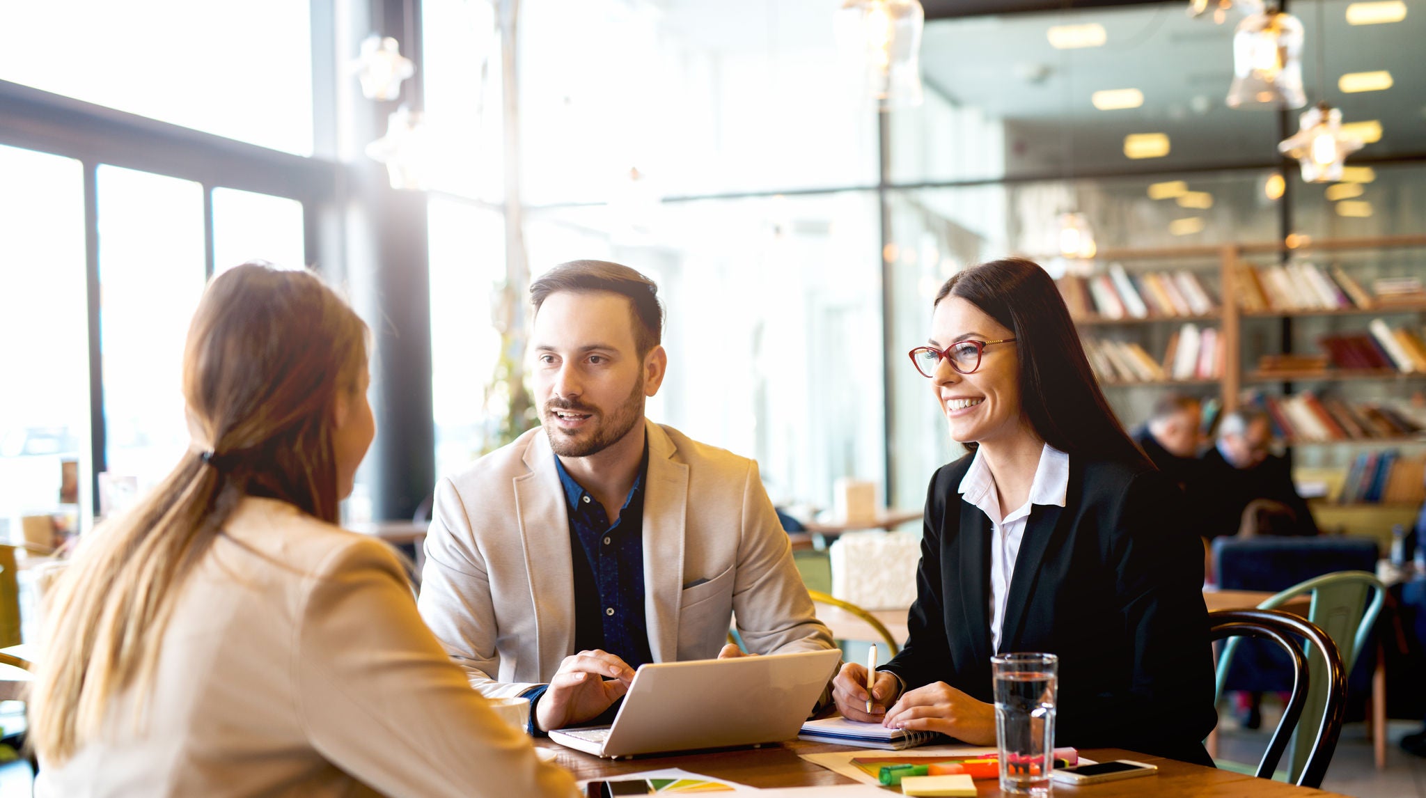 3 people in a business meeting